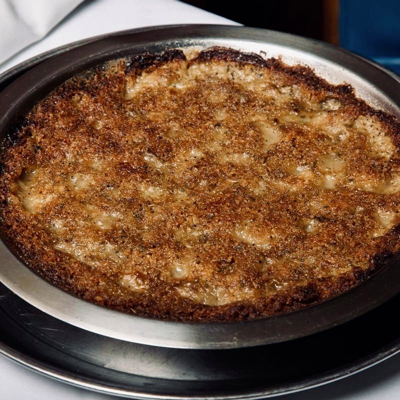Oysters Mosca, baked golden in the tin with Mosca's Italian seasoning and breadcrumbs