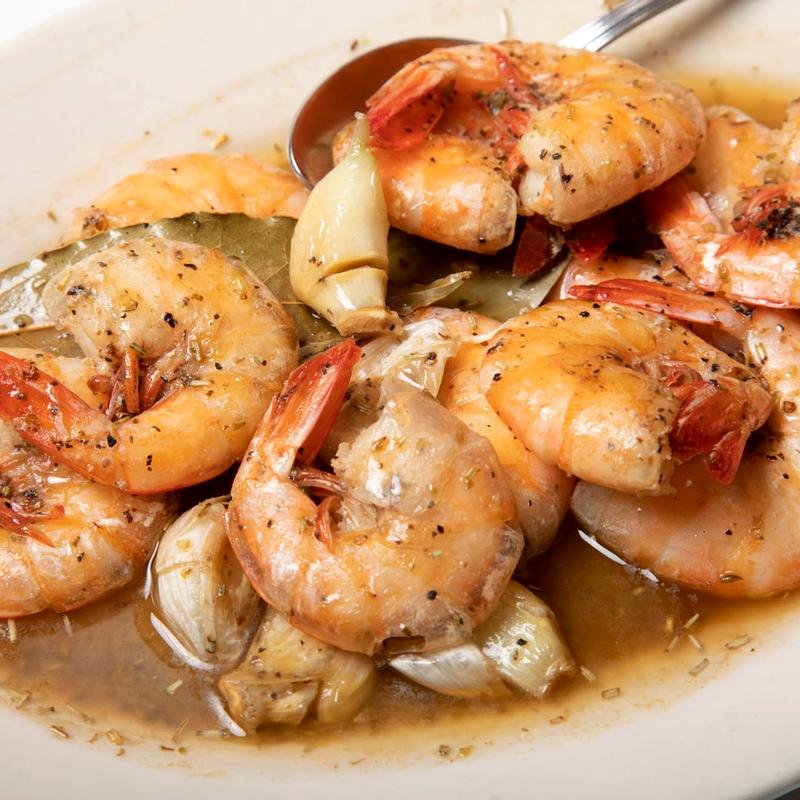 Shrimp Mosca — a dozen shell-on shrimp in garlic, bay leaf, and white wine